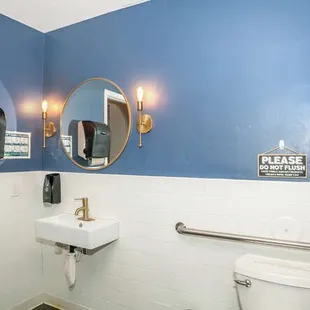 Two unisex restrooms with baby changing table.