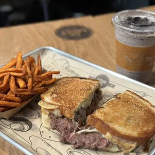 a sandwich and fries on a tray