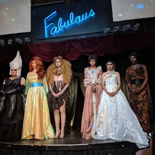 a group of models on a stage