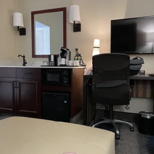 The front room. Fridge and microwave.