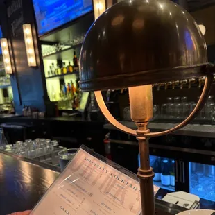 a menu on a table in a bar