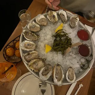 Chef's choice oysters, hush puppies, aperol spritz