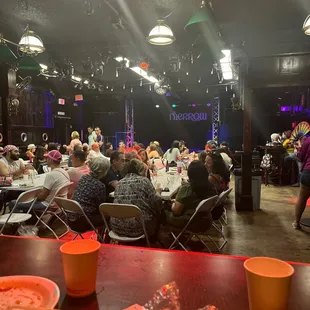 a large group of people sitting at tables