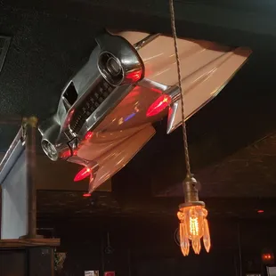 a car suspended from the ceiling