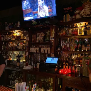 Bly Manor playing behind the bar