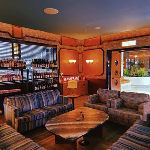 a living room with couches and a coffee table