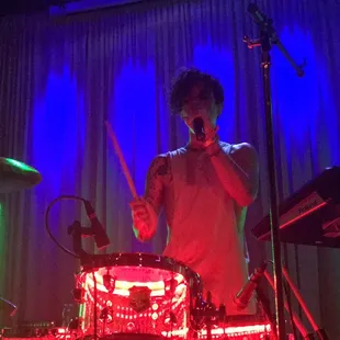 a man on stage with a microphone