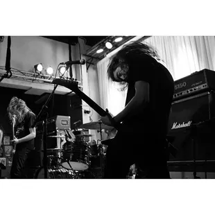 a black and white photo of a band performing