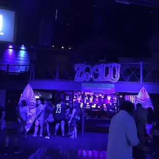 Merch booth, bar, tables.