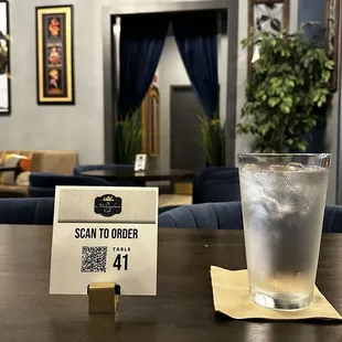 QR codes for convenient ordering and a view to the restroom in the back (single restroom for all)