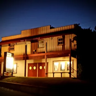 a building at night with lights on