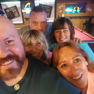 a group of people taking a selfie