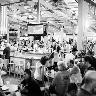 a large crowd of people at a bar