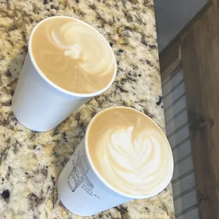 two cups of coffee on a counter