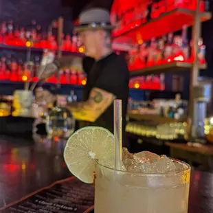 a margarita with a lime slice on the rim