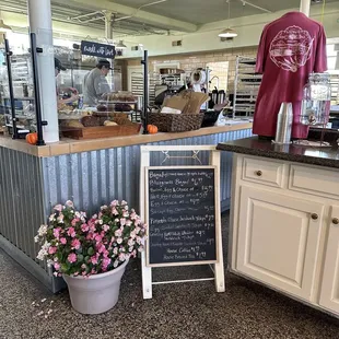 a counter with a chalkboard sign