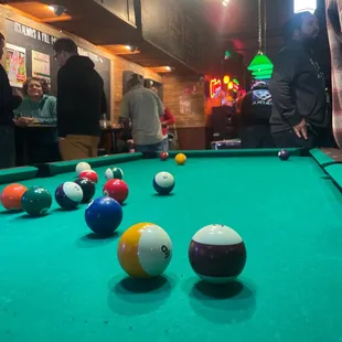 billiards and pool balls on a pool table
