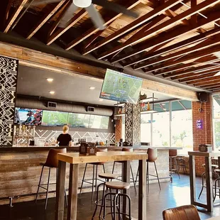 a bar with a ceiling fan