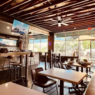 a restaurant with tables and chairs