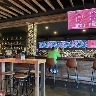 Full bar with lots of TVs