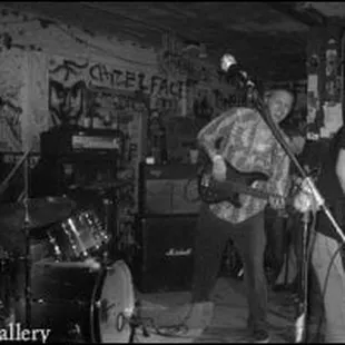 a black and white photo of a band playing