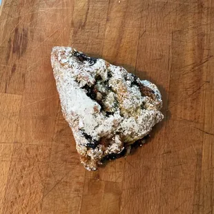 a scone on a wooden cutting board