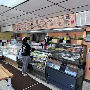 a woman standing in front of the counter