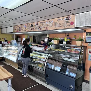 a woman standing in front of the counter