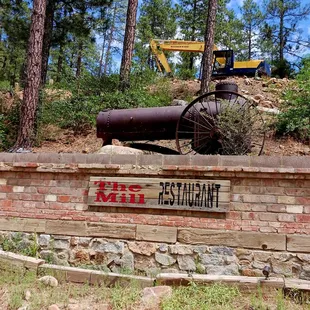 a large machine moving a log through the woods