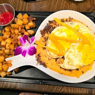 Grits &amp; Brisket with eggs served to your style.