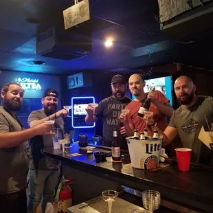 a group of men at a bar