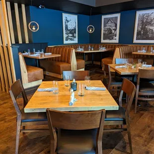 a dining room with tables and chairs