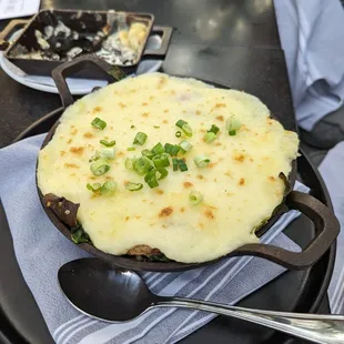 a skillet of food on a table