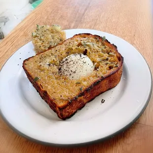 EGG-IN-A-HOLE $11.50 (egg, garlic sage butter, salt &amp; pepper on country toast); requested no salt on ours. Delish!!! Get this!!!