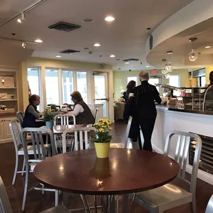 a dining area with tables and chairs