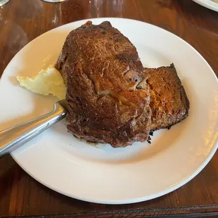 Ribeye steak with caramelized onion pudding and Yukon mashed potatoes.