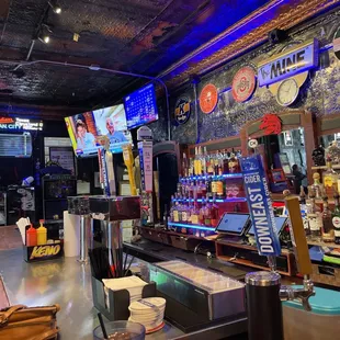 a bar with neon signs