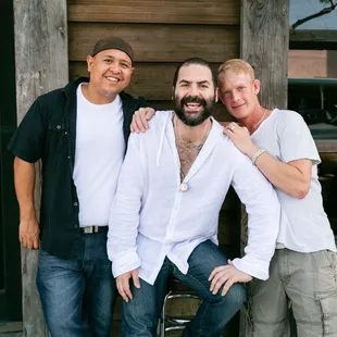 three men posing for a picture