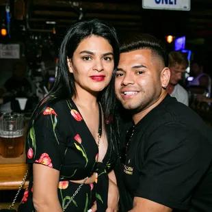 a man and a woman at a bar