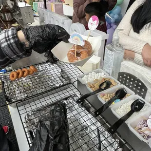 Behind the cart for the donuts