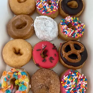 Maple, fruity pebbles, watermelon, The Simpsons, powdered sugar, glazed, chocolate, sprinkles and chocolate pretzel