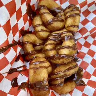 04.17.22 half dozen mini donuts with chocolate drizzle at Mahany Park Farmers Market... oh wait, that's more than 1/2 dozen :)