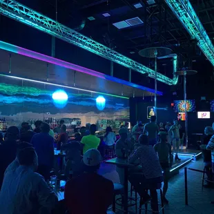 a crowd of people at a bar