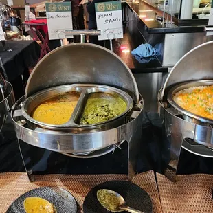 a variety of food items on a buffet table