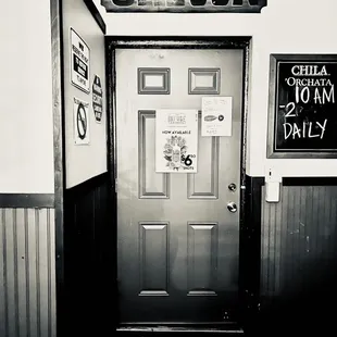 a black and white photo of a door
