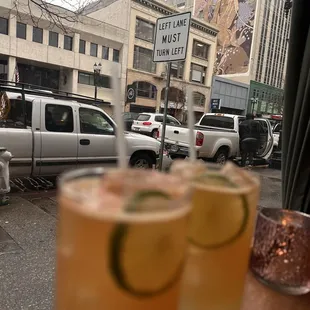 two glasses of lemonade on a table