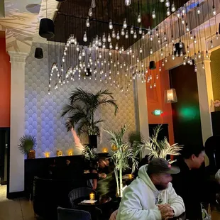 a man sitting at a table in a restaurant
