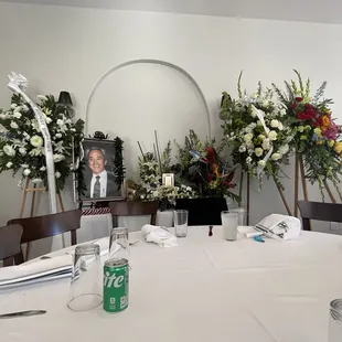 A seated table setup right next to my fathers display table
