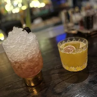 two cocktails on a bar