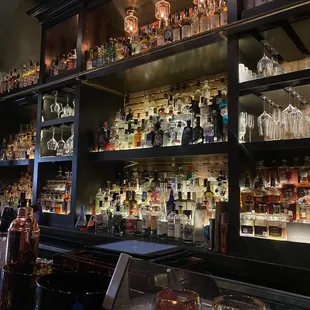 a bar filled with liquor bottles